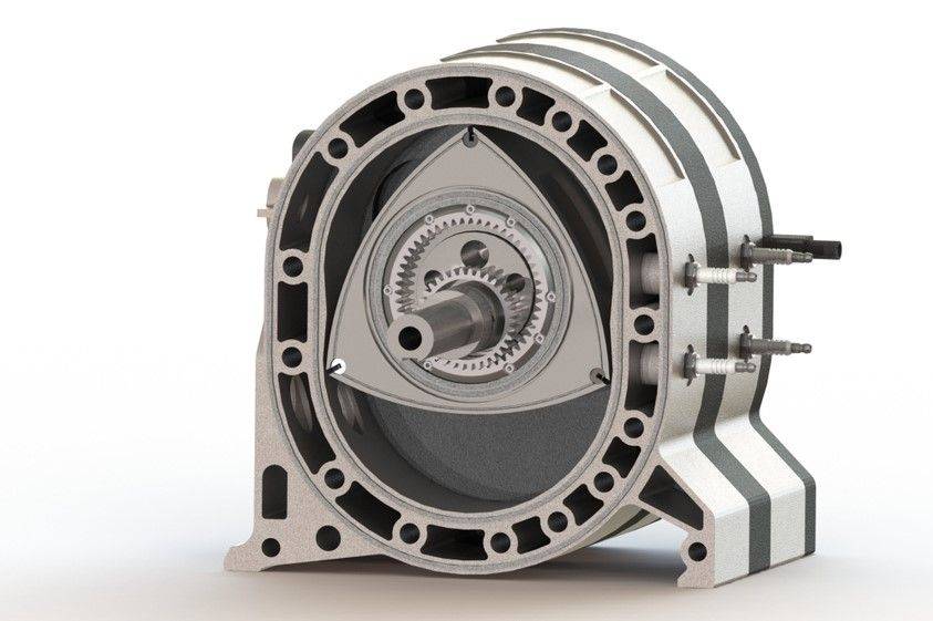 Trojboký píst pohybem v oválné skříni mění objem uzavřených komor.